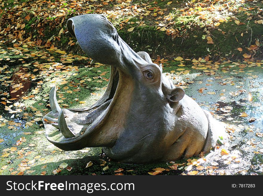 Sculpture of hippopotamus head with open mouth. Sculpture of hippopotamus head with open mouth