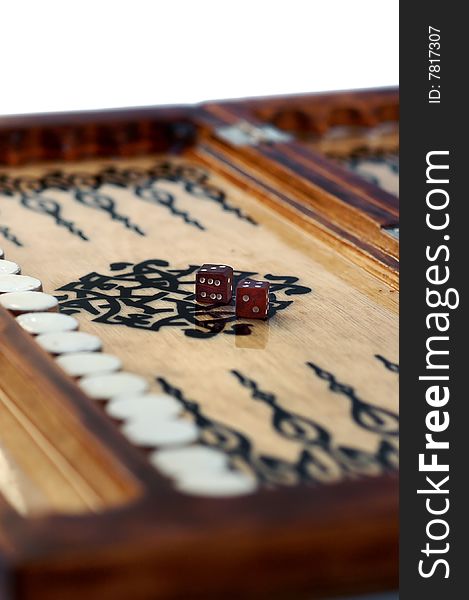 Isolated Wooden handmade backgammon board with two dices