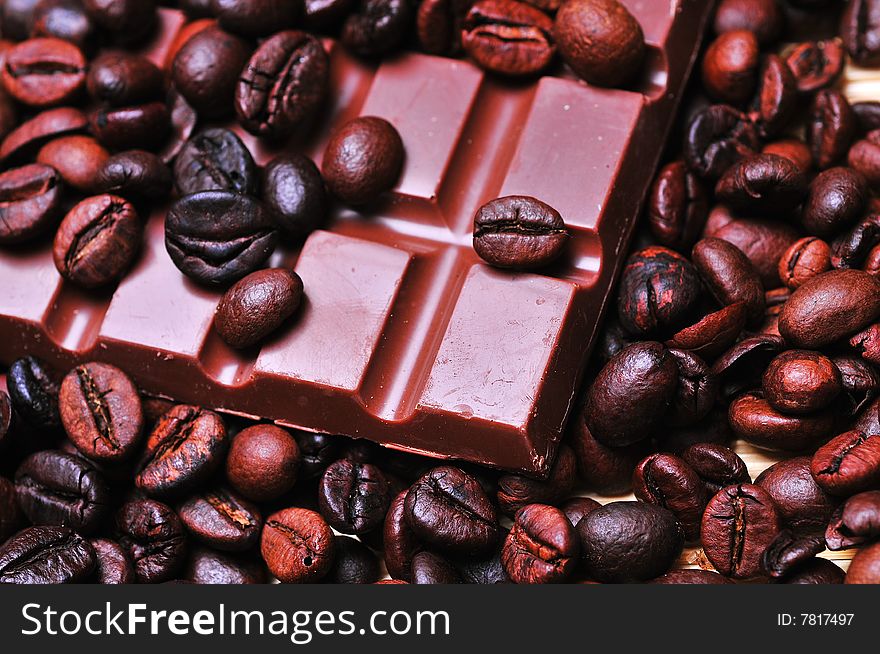 Close up of a coffee beans and chocolate. Close up of a coffee beans and chocolate