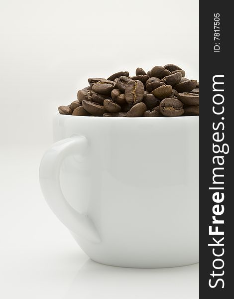 Crop image of coffee bean in ceramic cup. Crop image of coffee bean in ceramic cup