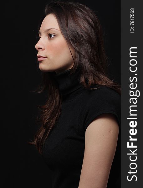 Young brunette on a black background. Young brunette on a black background