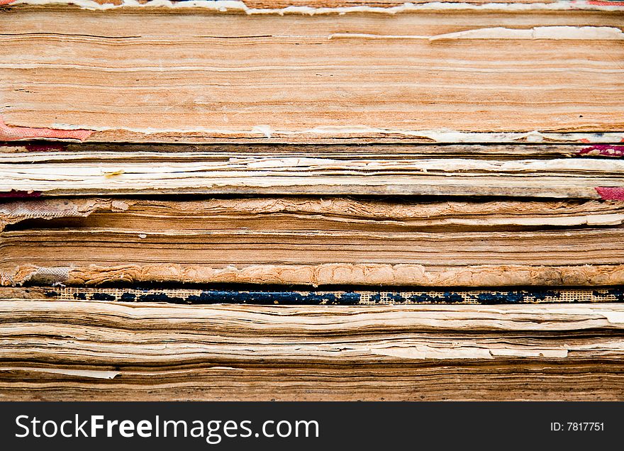 Background made of a stack of aged books. Background made of a stack of aged books