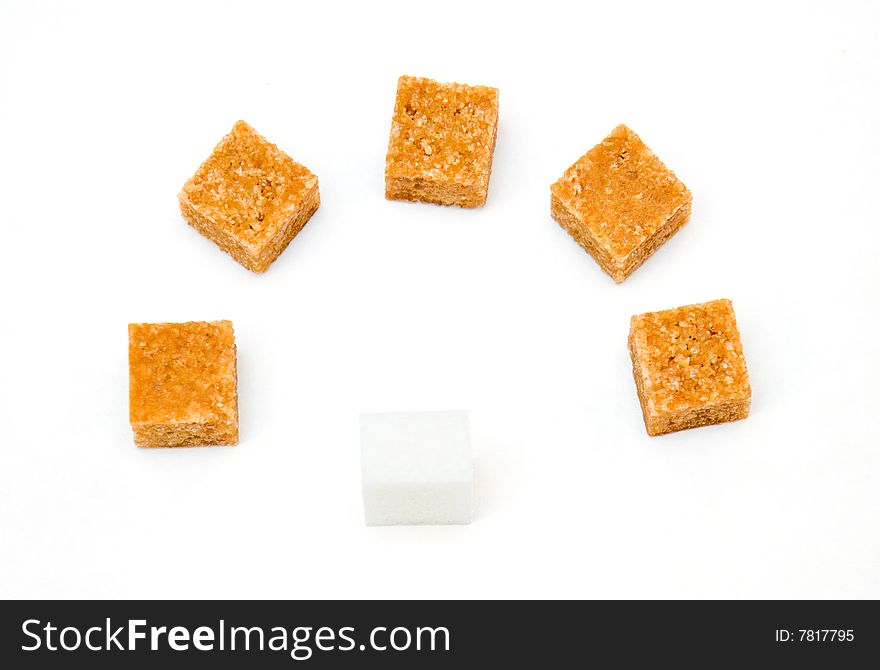 Block of white sugar before five blocks of brown sugar isolated on white background. Block of white sugar before five blocks of brown sugar isolated on white background