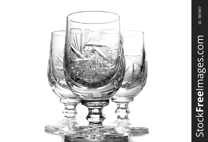 Three crystal glasses isolated on white