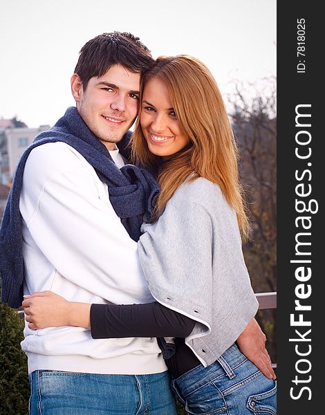 Young couple having fun outside, shot with studio lights