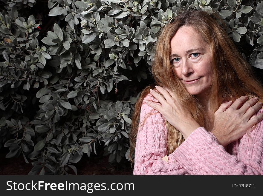 Middle aged female crossing her arms over her chest. Middle aged female crossing her arms over her chest