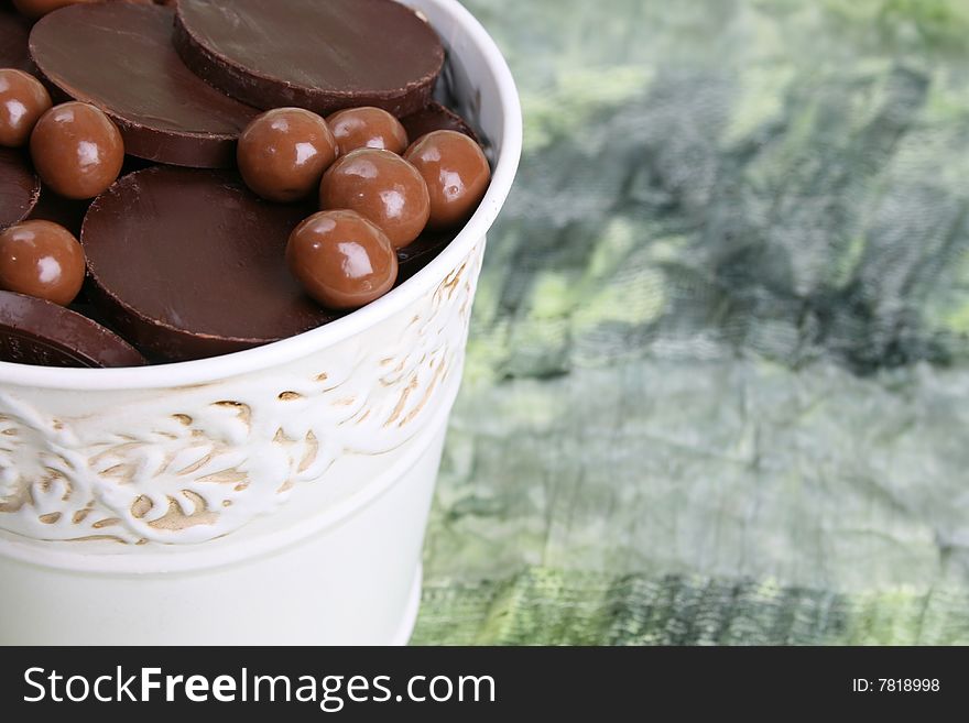 Variety of chocolates in a small white bucket