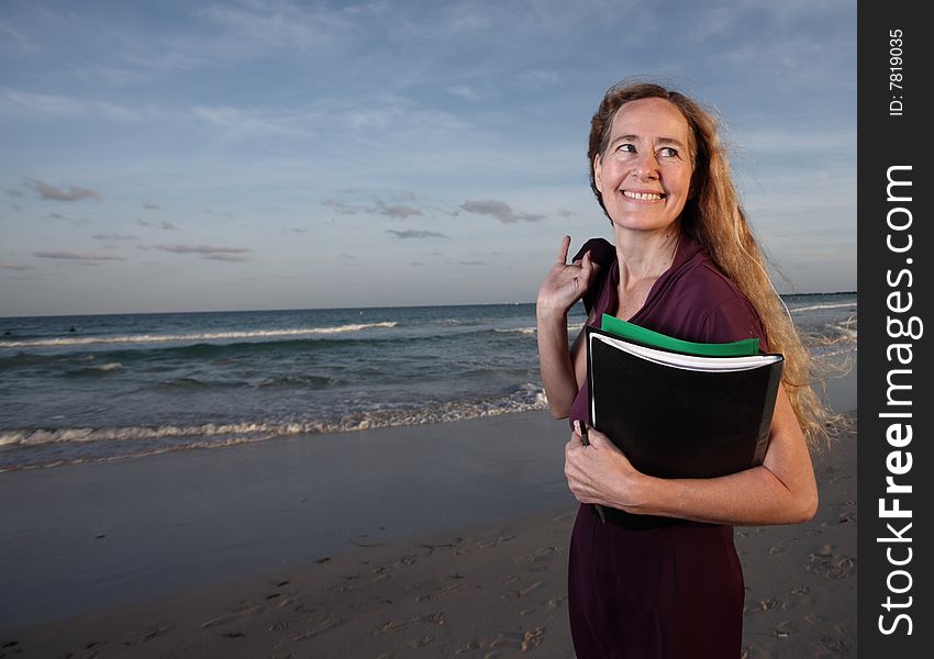 Smiling secretary on the beach