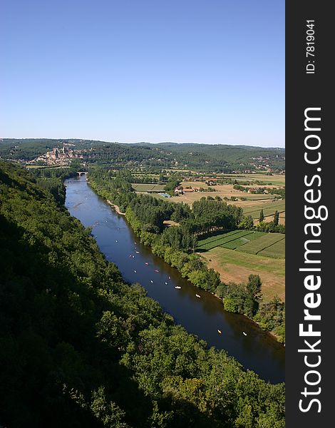 Image of canoes making their way down the river. Image of canoes making their way down the river