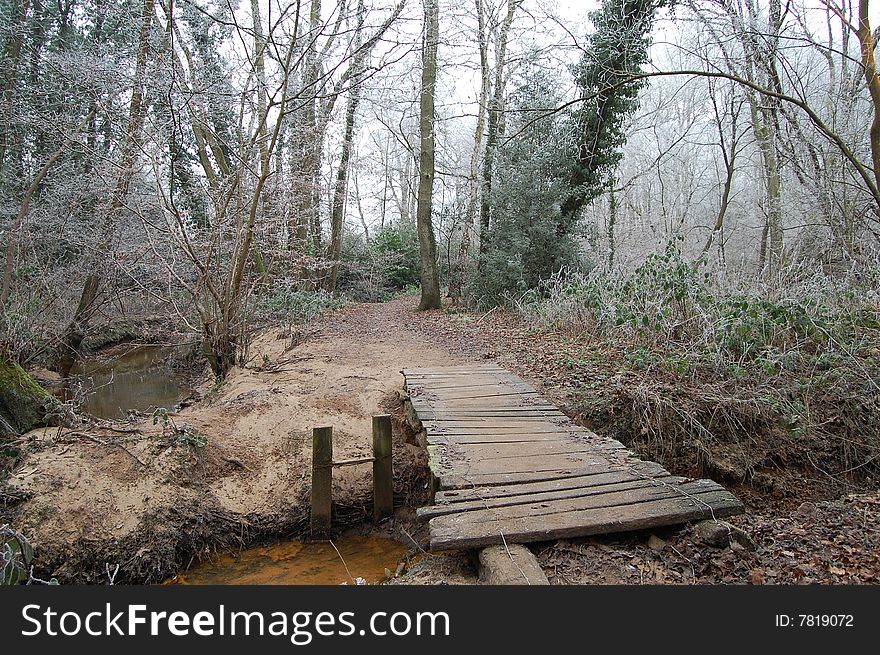 An old wooden bridge in winter