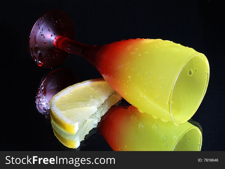 The overturned wine glass on a black background. The overturned wine glass on a black background