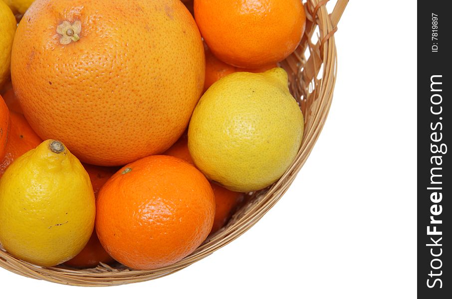 Basket wth grapefruit, lemons and oranges .