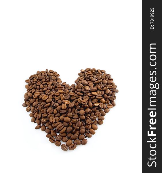 Form of the heart from fried fragrant brown grains of coffee. Form of the heart from fried fragrant brown grains of coffee