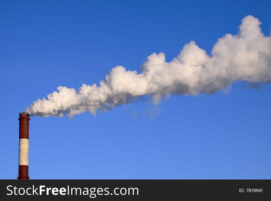 Power plant pollution on blue sky background