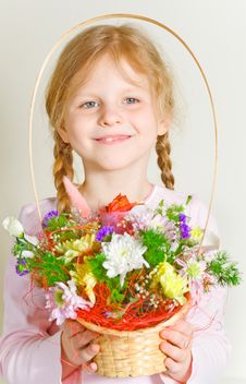 Small Girl With A Basket Of Flowers Royalty Free Stock Photos
