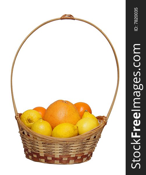Basket wth grapefruit, lemons and  oranges .