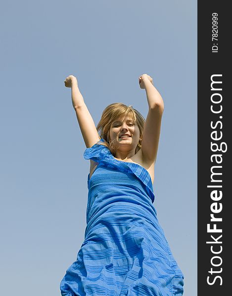 Jumping teenager on background of blue sky