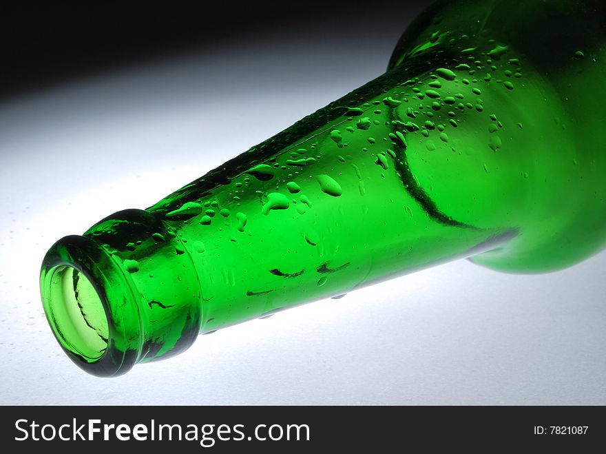 Neck 
of 
a 
green 
bottle 
and 
drop. Neck 
of 
a 
green 
bottle 
and 
drop