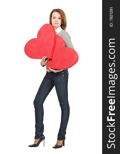 Pretty model girl holding two hearts over white