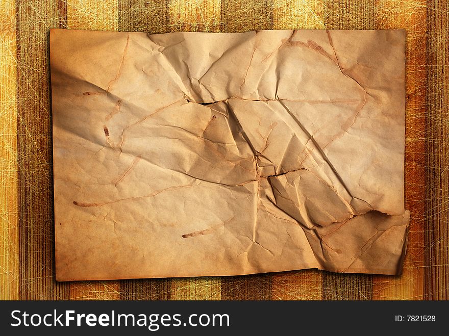 Old natural scratched wooden desk with old paper. Old natural scratched wooden desk with old paper