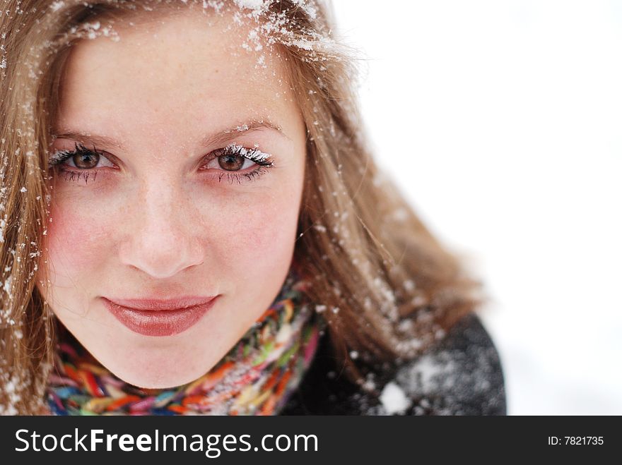 Beautiful young woman with snow on her hair. Beautiful young woman with snow on her hair