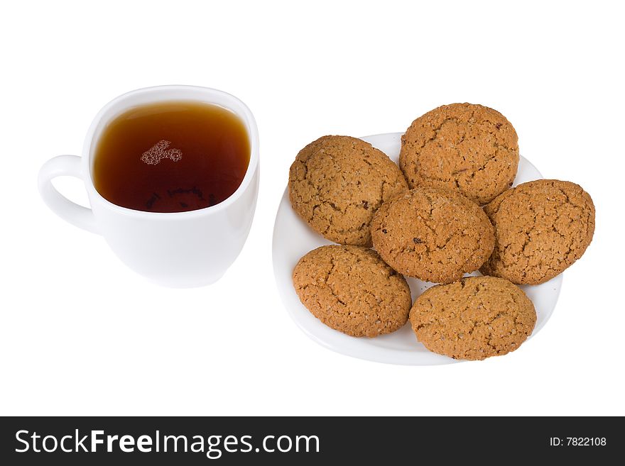 Tea and five cookies on plate, isolated on white