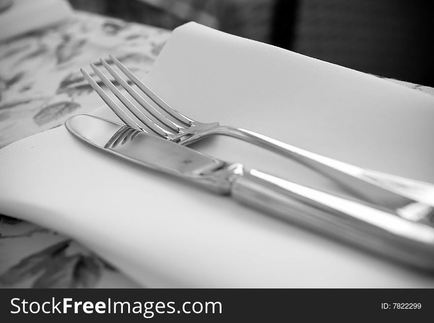 Black and white fork and knife on the table. Black and white fork and knife on the table