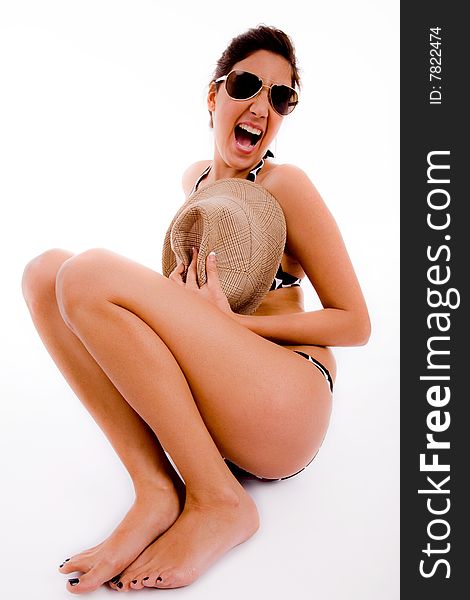 Side view of shouting sensuous woman with sunglasses and hat against white background. Side view of shouting sensuous woman with sunglasses and hat against white background