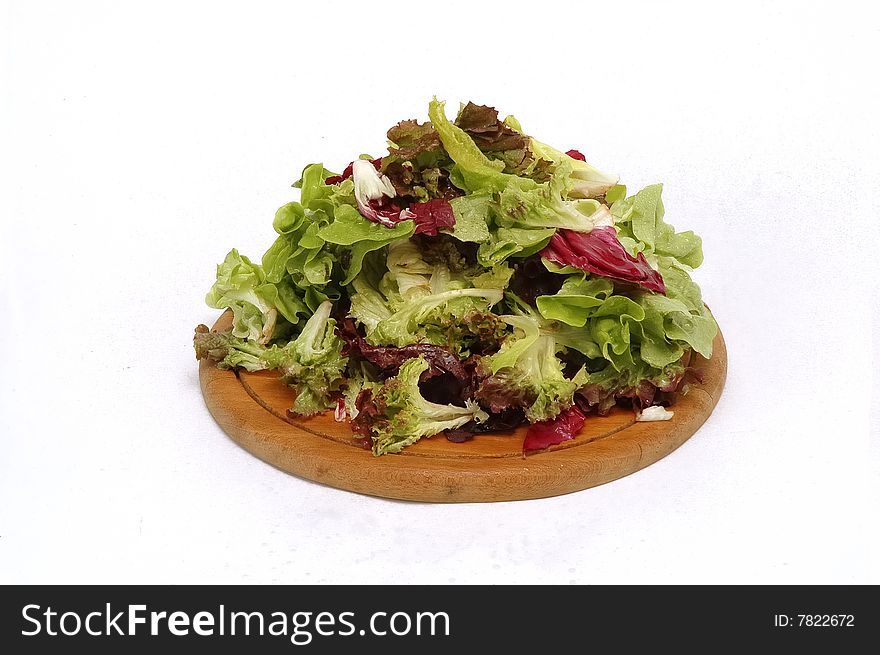 Salad ingredients on wood plate