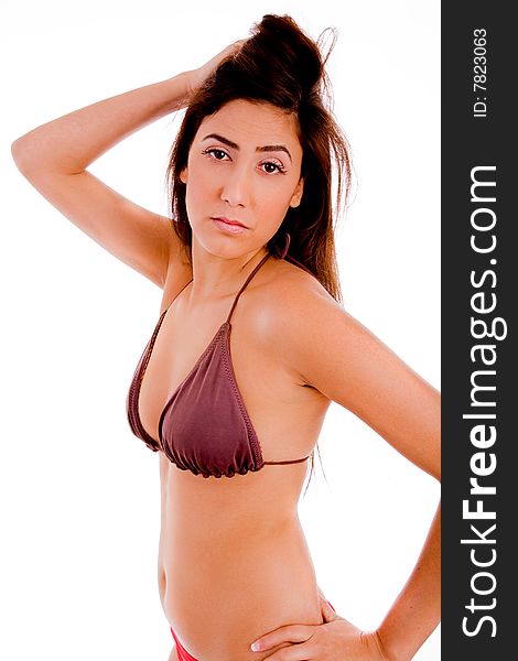 Side view of sexy female in bikini looking at camera on an isolated white background