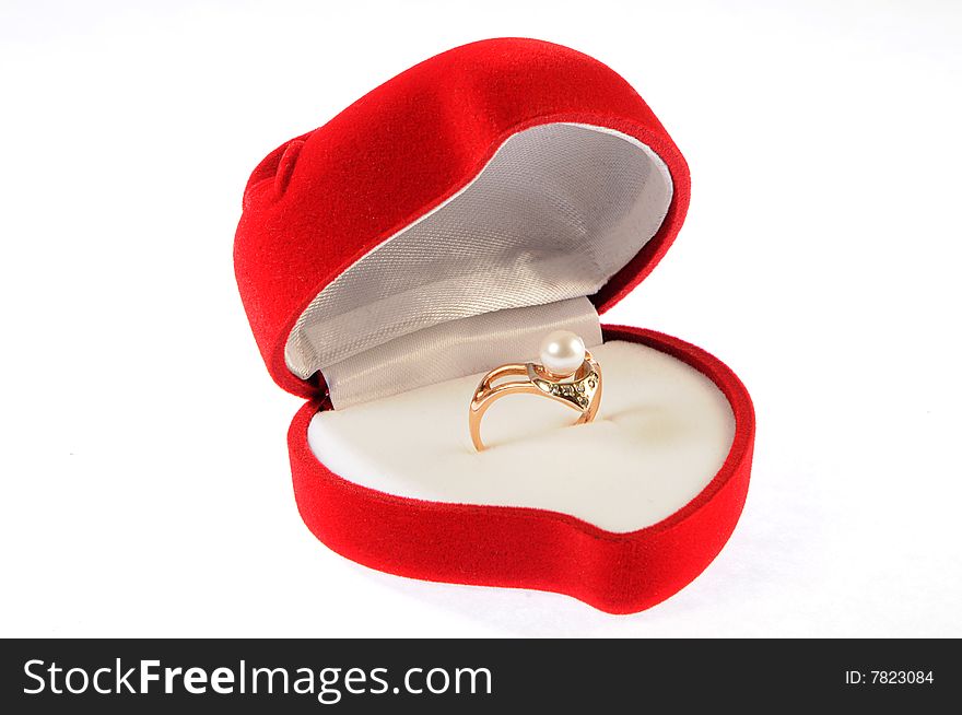 Golden ring with pearl in isolated open red box. Golden ring with pearl in isolated open red box