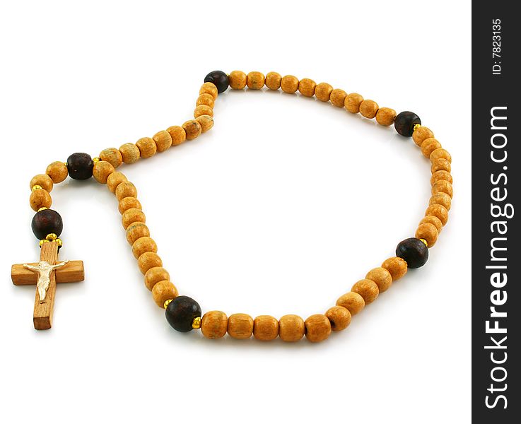 Wooden rosary and cross isolated on a white background