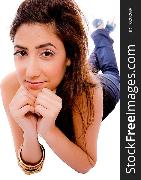 Front view of smiling young female looking at camera on an isolated background