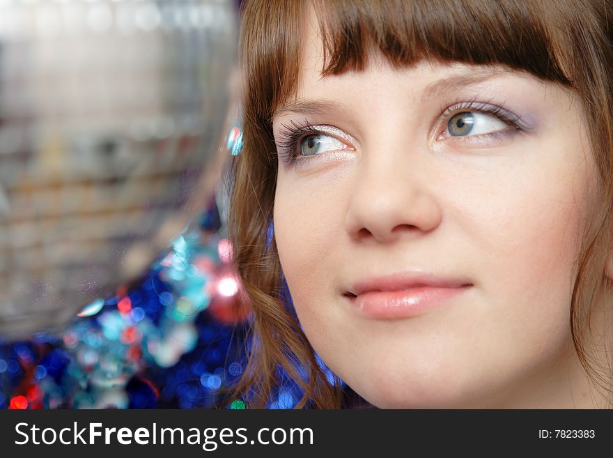 Portrait of beautiful young lady and disco ball closeup. Portrait of beautiful young lady and disco ball closeup