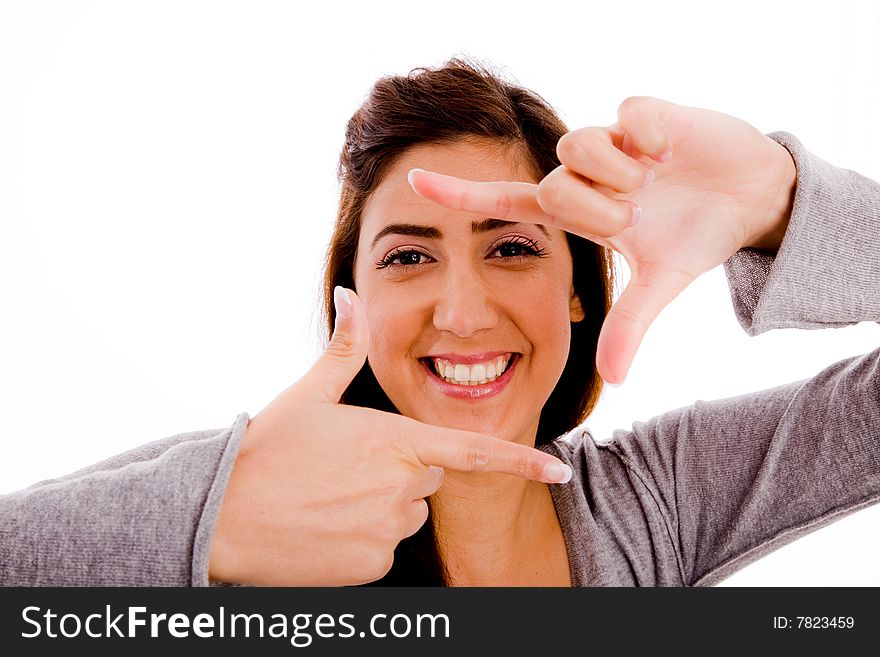 Portrait of smiling woman showing framing gesture against white background. Portrait of smiling woman showing framing gesture against white background