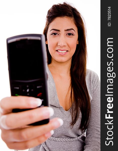 Portrait of smiling woman showing cell phone on an isolated white background