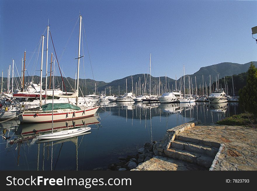 Sail yachts mooring in mediteranian yacht-club