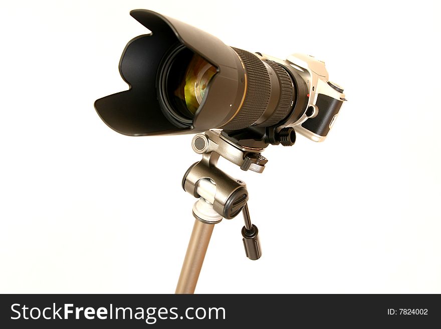 Professional tele lens on the tripod isolated on white. Professional tele lens on the tripod isolated on white.