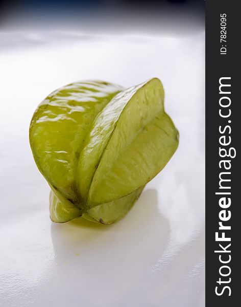 One single star vegetable laying on a white background.