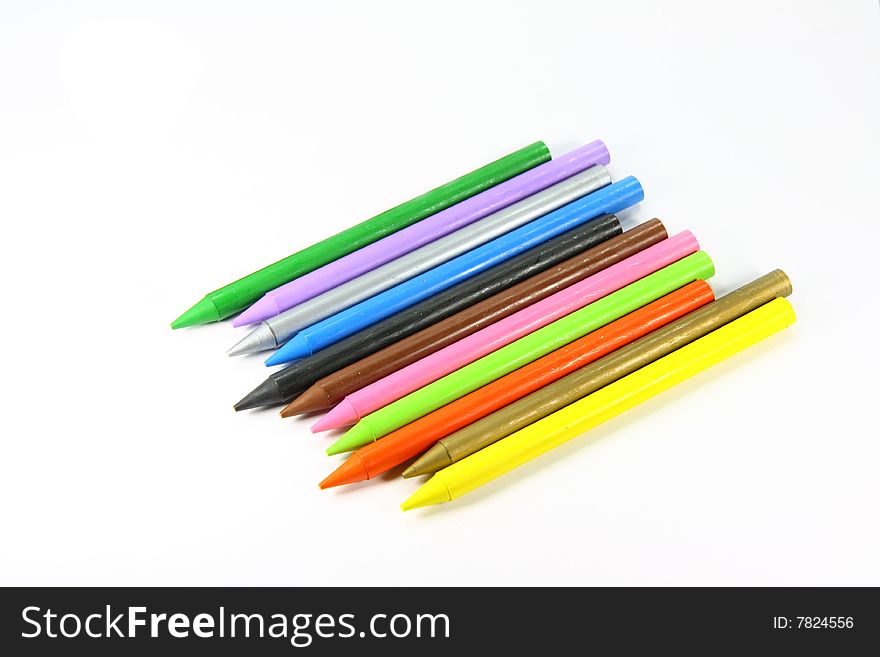 Set of coloured penciles on a white background