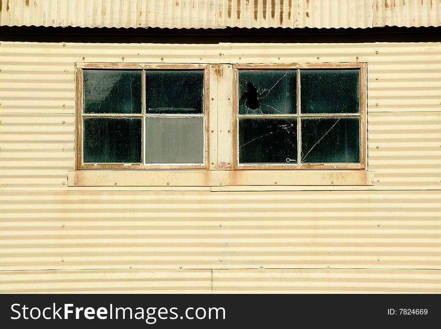 Windows on an old currugated metal building. Windows on an old currugated metal building.