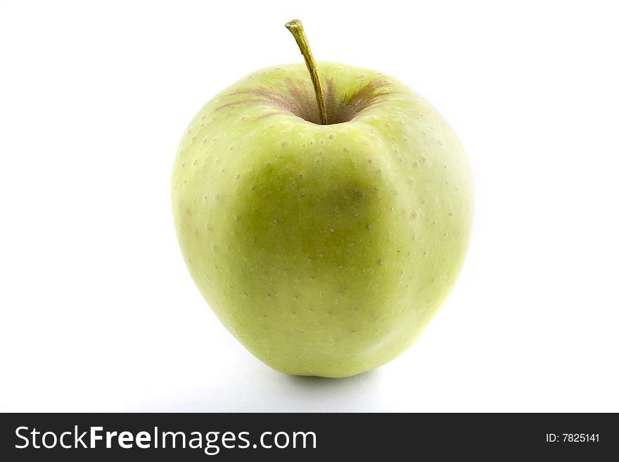 A fresh, crisp green apple isolated on a white background