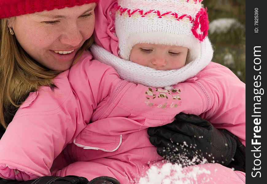 Mother and daughter look at snow. Mother and daughter look at snow