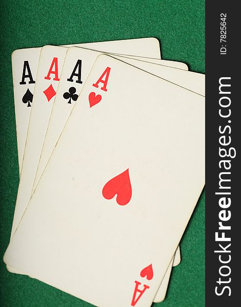 Cards Four Aces on a green felt background Portrait. Cards Four Aces on a green felt background Portrait