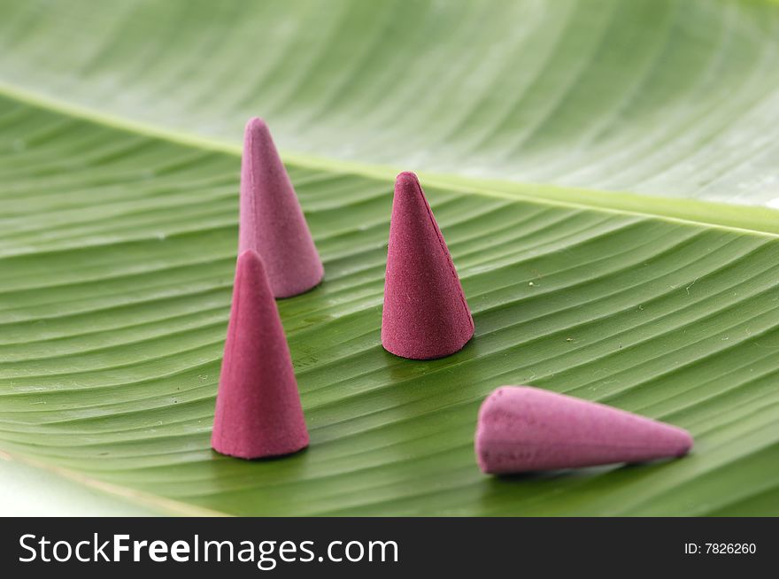 Sandalwood incense cones on banana leaf. Sandalwood incense cones on banana leaf