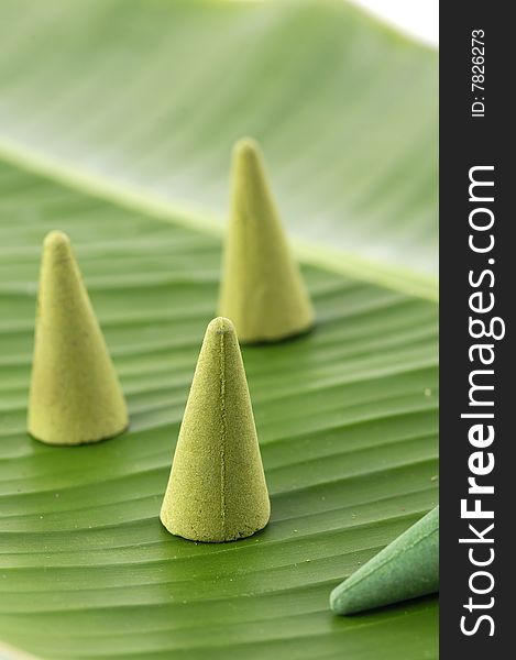 Sandalwood incense cones on banana leaf. Sandalwood incense cones on banana leaf