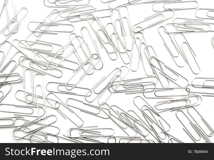A macro shot of many paperclips on white. A macro shot of many paperclips on white.