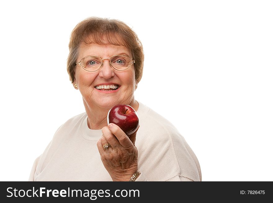 Attractive Senior Woman with Apple Isolated on a White Background.