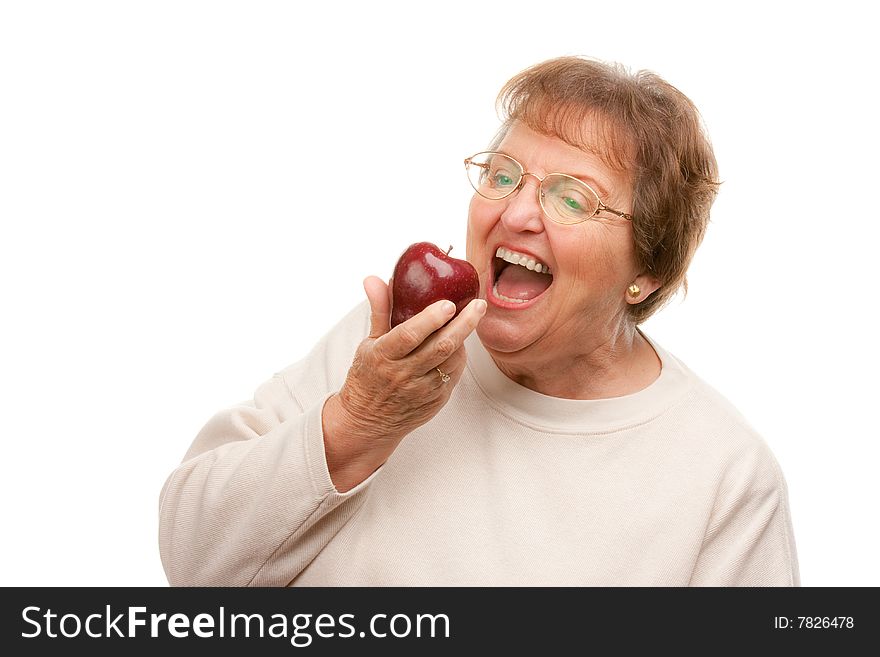 Attractive Senior Woman with Apple Isolated on a White Background.