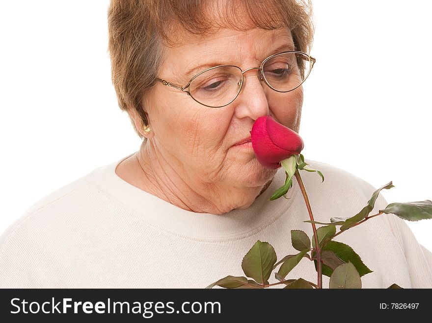 Attractive Senior Woman with Red Rose Isolated on a White Background.